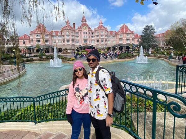 Sanket and Krina at the entrance of Disneyland Paris